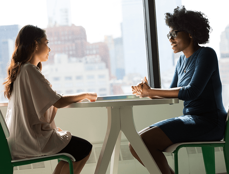 Amplify Your Practice Level 1 Discovery Image - Two women at table